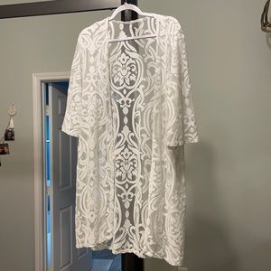 White lacy overwrap.  Great to wear over boho dresses.